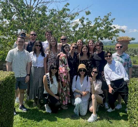 Danielle Xu with a group of faculty in Italy