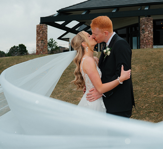 People smiling at a wedding.
