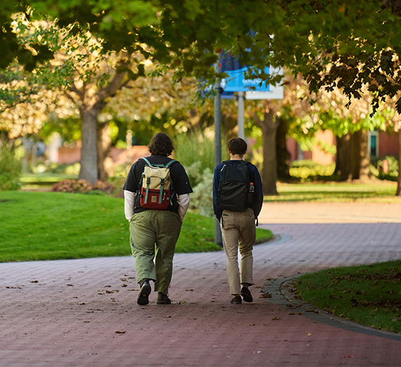 students walk on college campus