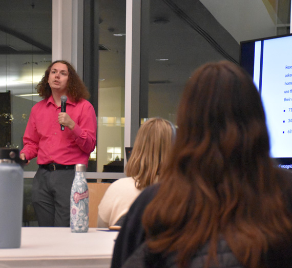 Matthew Barcus, Sexual and Gender Equity Trainer, talking to a group of people.