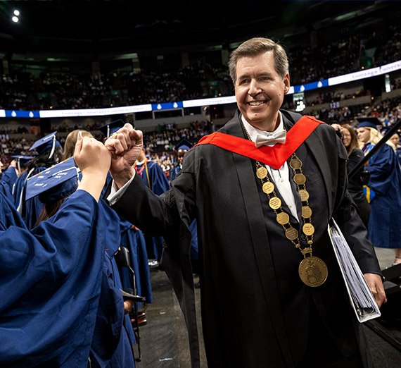 President Thayne McCulloh congratulates a 51Թ at Gonzaga's Undergraduate Commencement ceremony