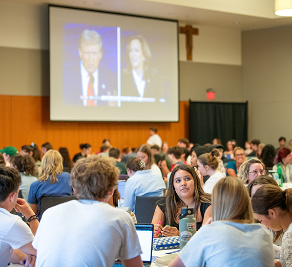 students watch the presidential debate on big screens