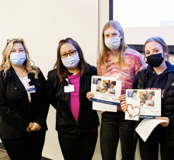 Nursing students Elaine Frank and Quincy Neal pose with certificates 