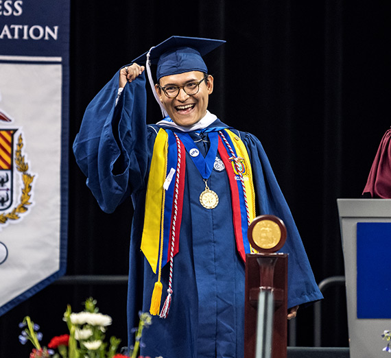 GSBA president Miguel Acosta at commencement  