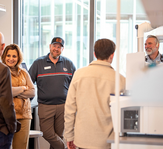 people gather in a lab