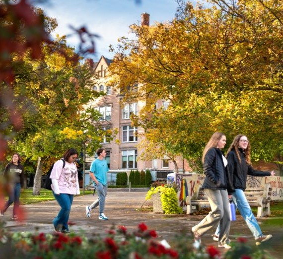 Students walking along Bulldog Alley behind College Hall.