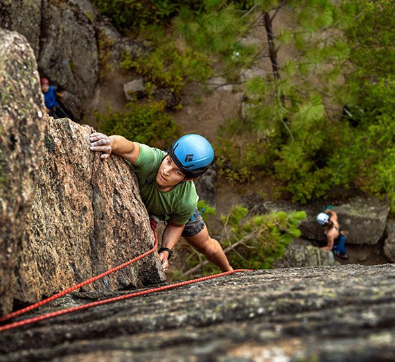 Instructor Matt Edenfield guides students on a rock climbing trip at Minnehaha Park as a part of Immersive Outdoor Learning.