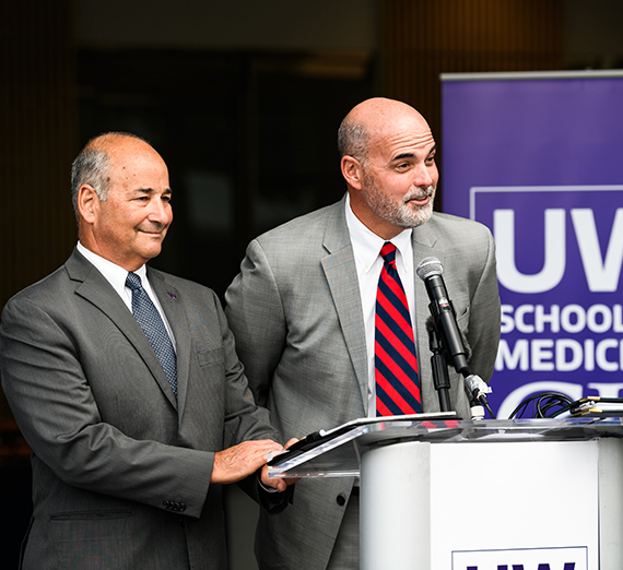 two men at podium