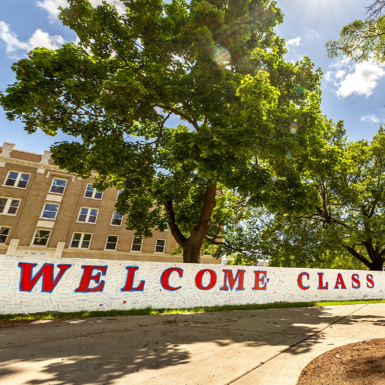 First-year students participate in the Welcome Walk during Orientation Weekend.