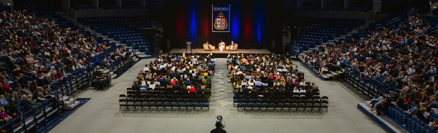 View of crowd and stage at the 2018 Presidential Speaker Series event featuring Tarana Burke and Ronan Farrow. 