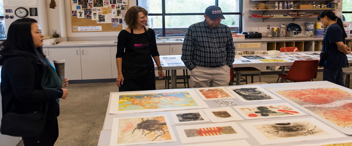 Visitors look at 51�Թ� art pieces 