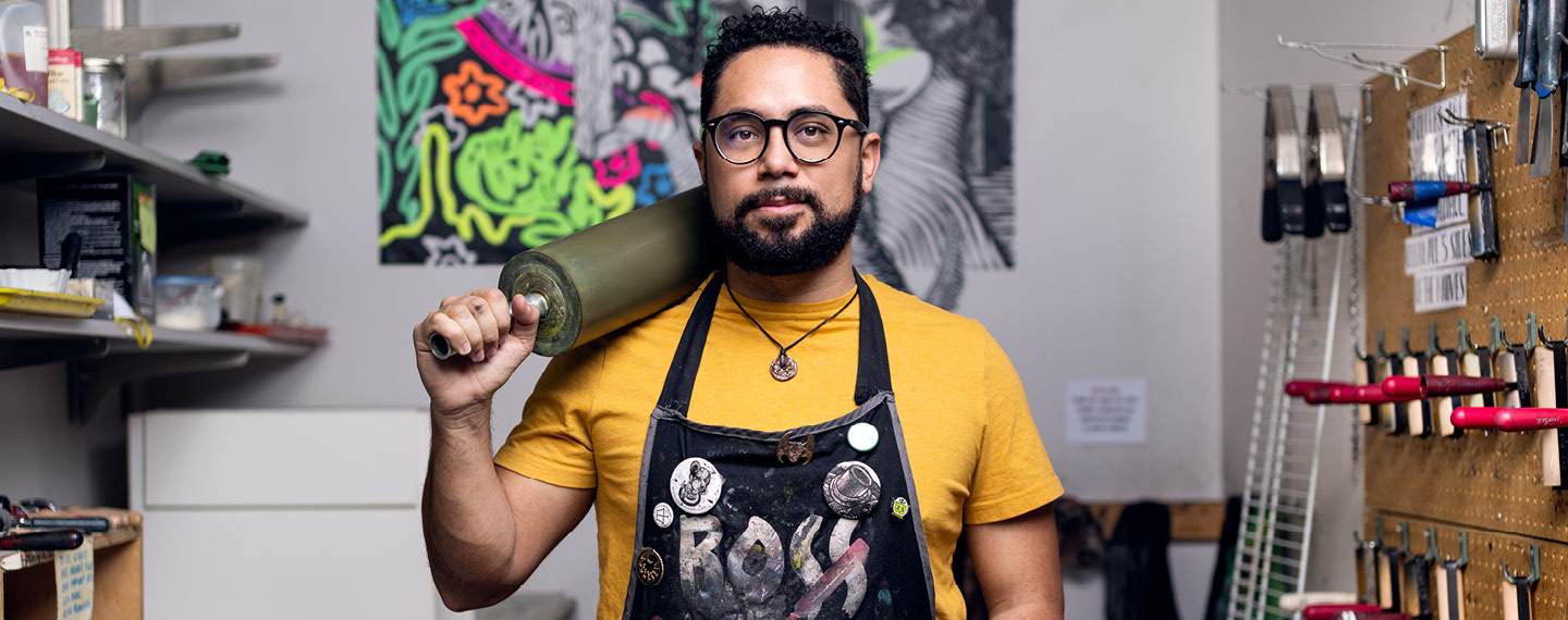 Reinaldo Gil Zambrano holding a screen printing roller