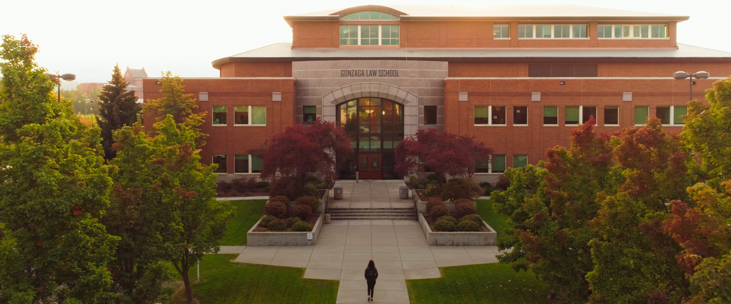 A student walks into the Gonzaga Law School building.