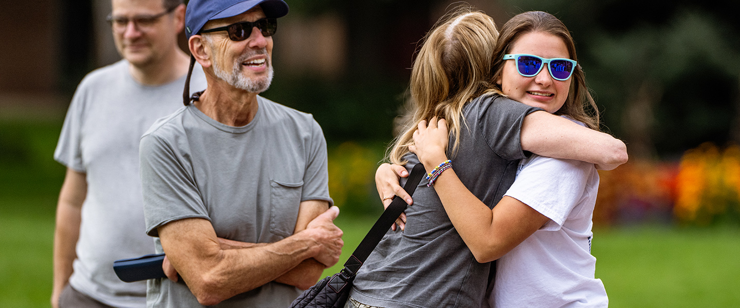 Gonzaga parents hug their daughter.