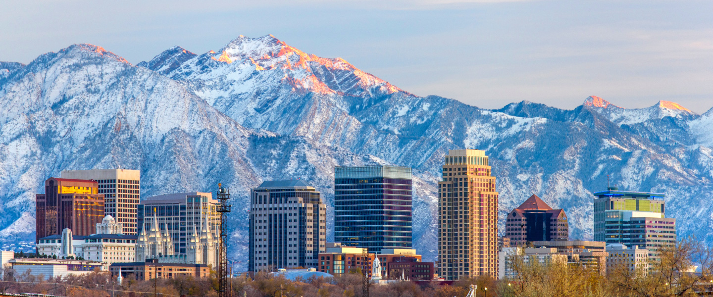  Downtown Salt Lake City cityscape with mountains in the background.