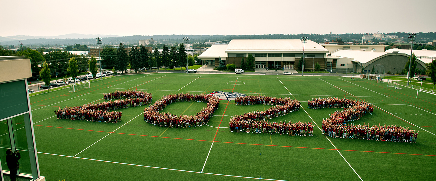 Entering Gonzaga student with an anticipated 2022 graduation form 2022 on a field