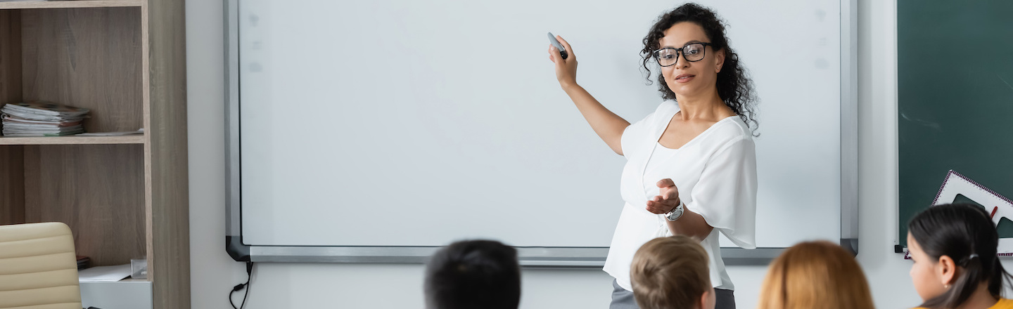 A teacher instructs a class.