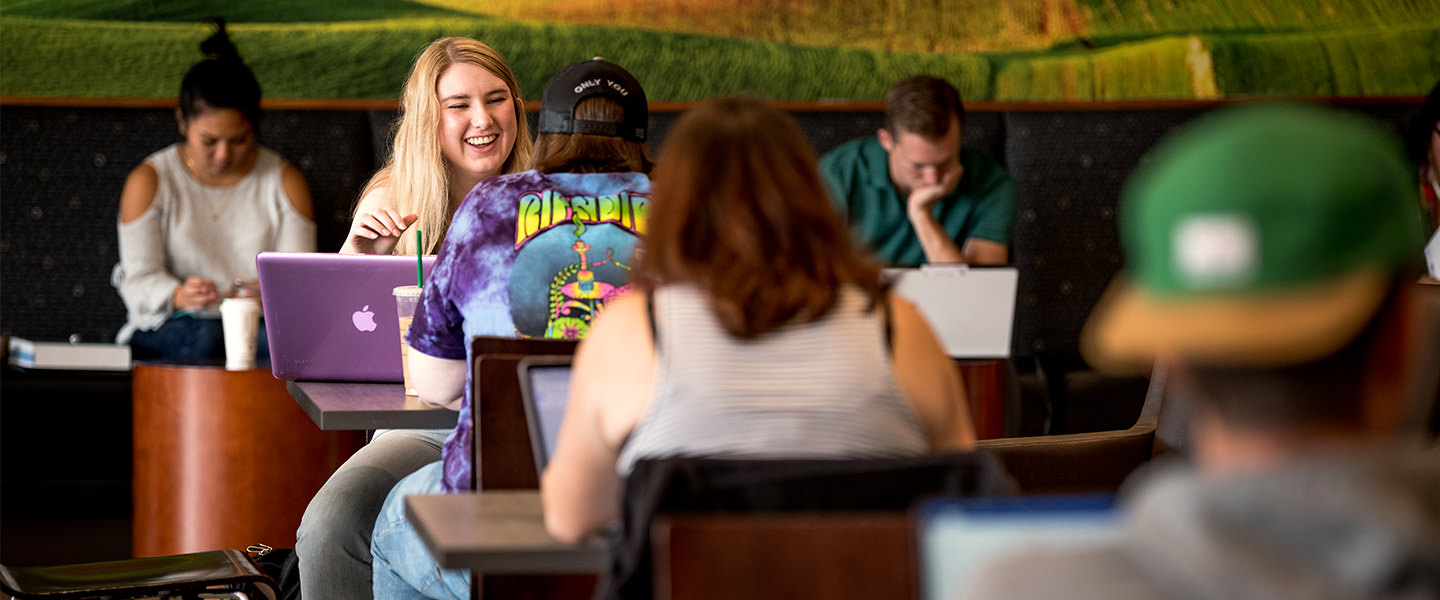 students studying and smiling