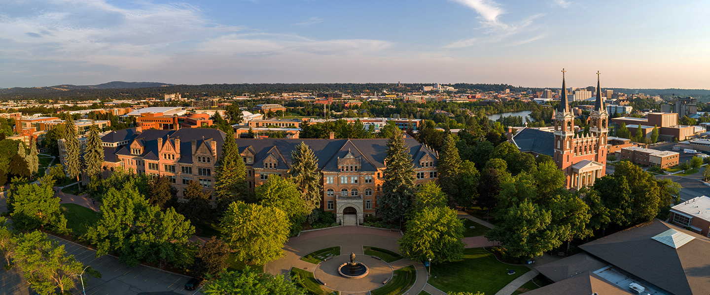 An aerial of Gonzaga's campus with Spokane in the background.